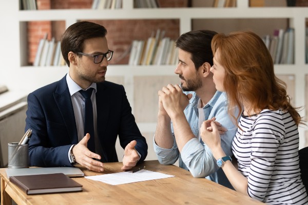 Business man talking with couple